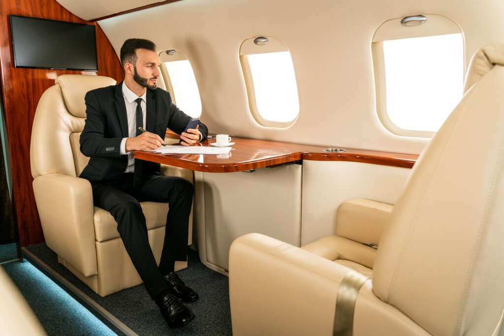 Businessman flying on private jet